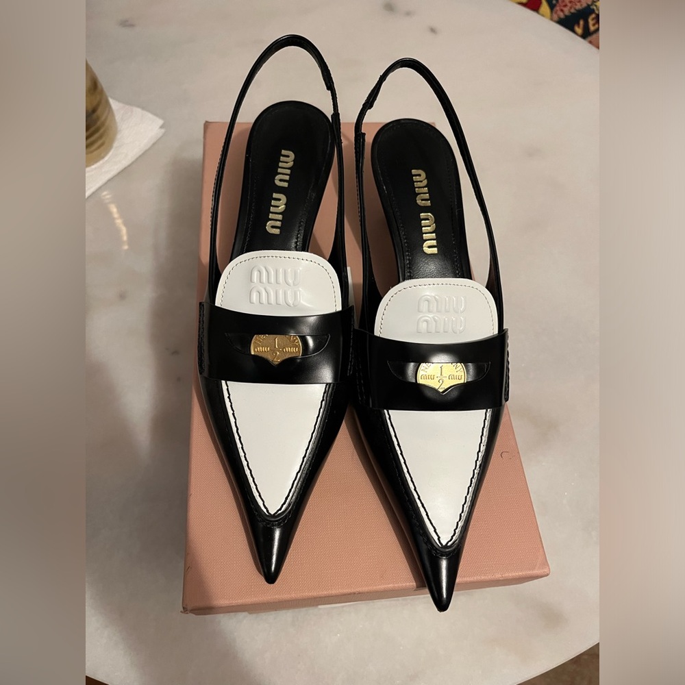 Miu Miu Leather penny loafers with heel